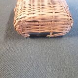 Set of two glass and wicker bottles