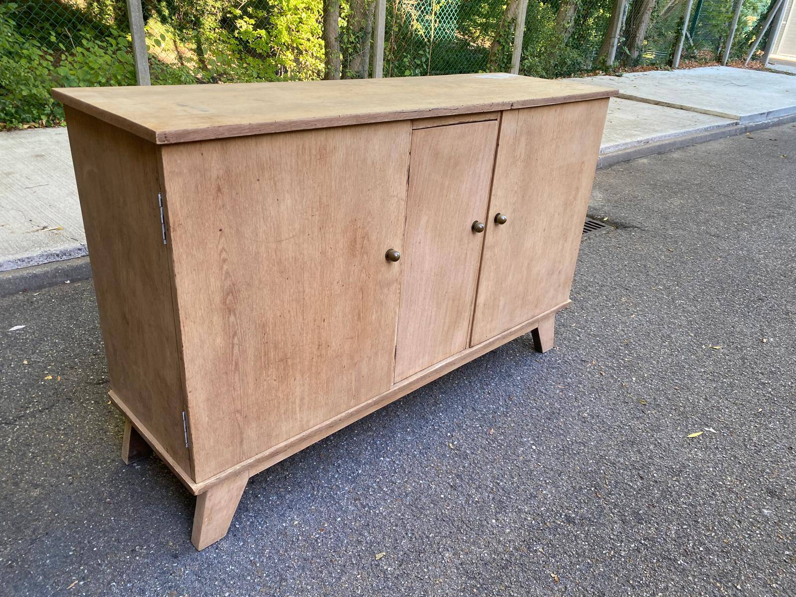 Vintage 1950s oak enfilade buffet with tapered legs.