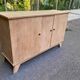 Vintage 1950s oak enfilade buffet with tapered legs.