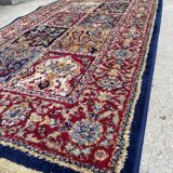 Vintage mechanical Turkish rug with box decoration on a red and navy blue background 139 x 68 cm