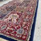 Tapis Turc mécanique vintage à décor de caissons sur fond rouge et bleu marine 139 x 68 cm