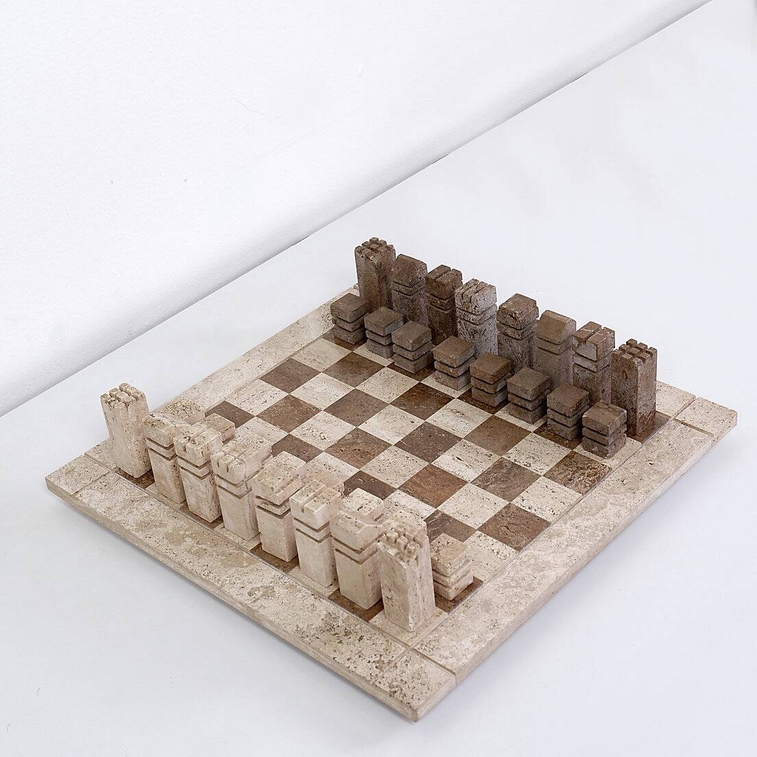Modernist two-tone travertine chess set, Italy, 1970s