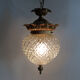 Brass and diamond-tipped chiseled glass globe hanging lamp