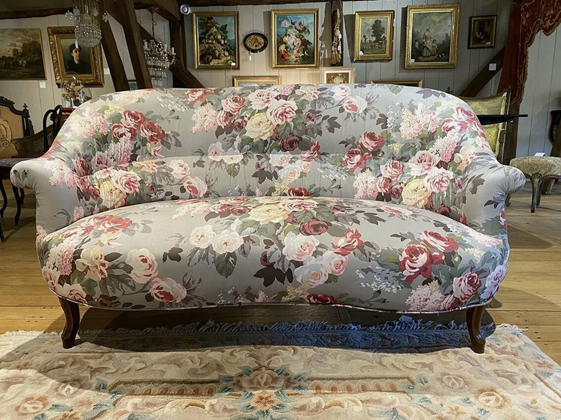 Napoleon III sofa upholstered in a floral patterned fabric