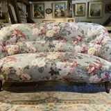 Napoleon III sofa upholstered in a floral patterned fabric