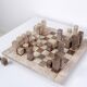 Modernist two-tone travertine chess set, Italy, 1970s