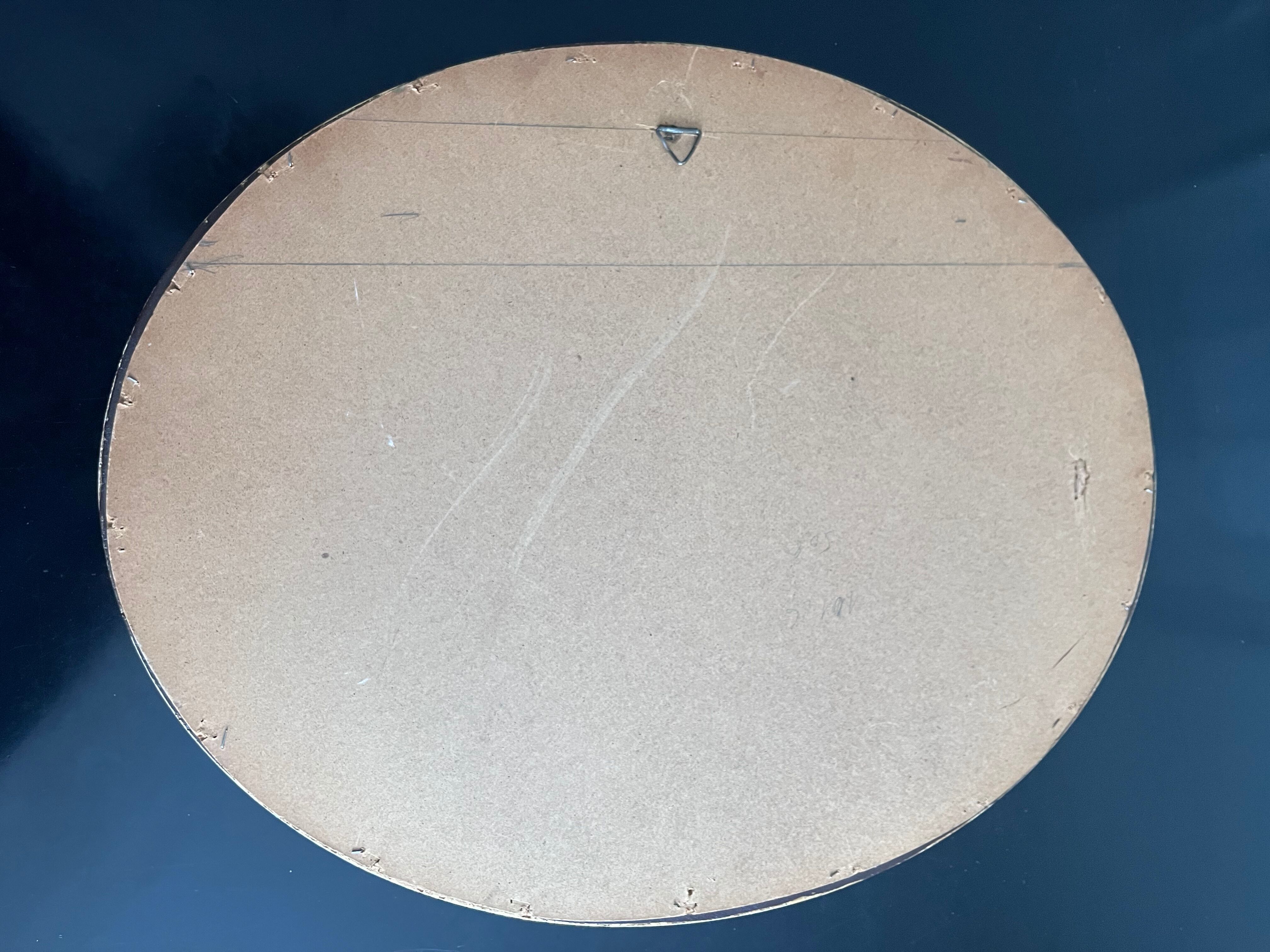 Oval mirror in gilded wood 43x53cm