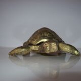 Golden brass ashtray has a turtle-shaped