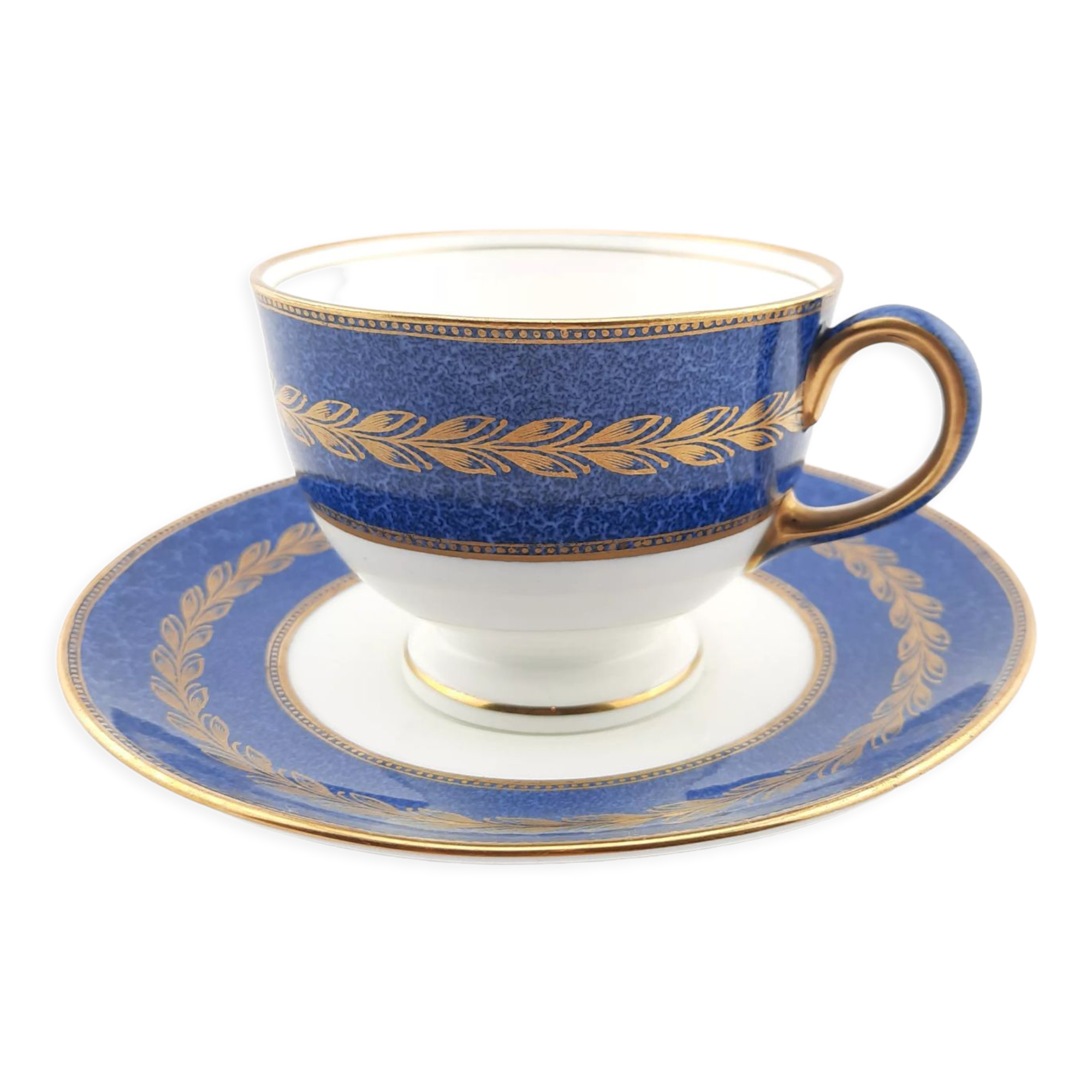 Antique Wedgwood teacup and saucer, bone china. Powder blue and gold English footed cup and saucer,
