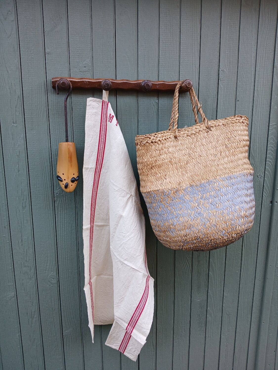 Small antique wooden wall coat rack.