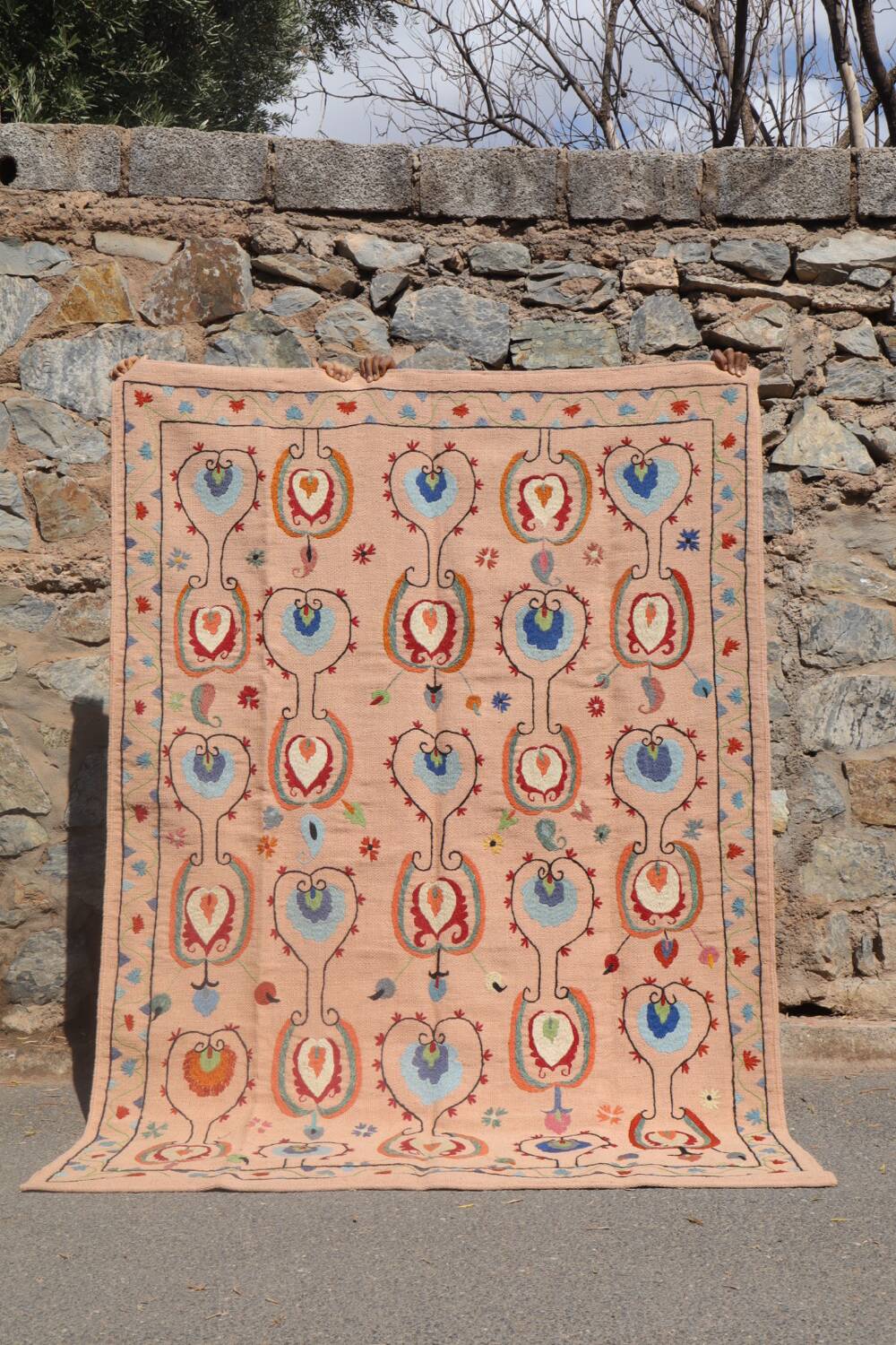 Salmon pink suzani kilim rug with embroidered patterns