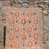 Salmon pink suzani kilim rug with embroidered patterns