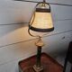Empire-style table lamp in gilded bronze from the 19th century.
