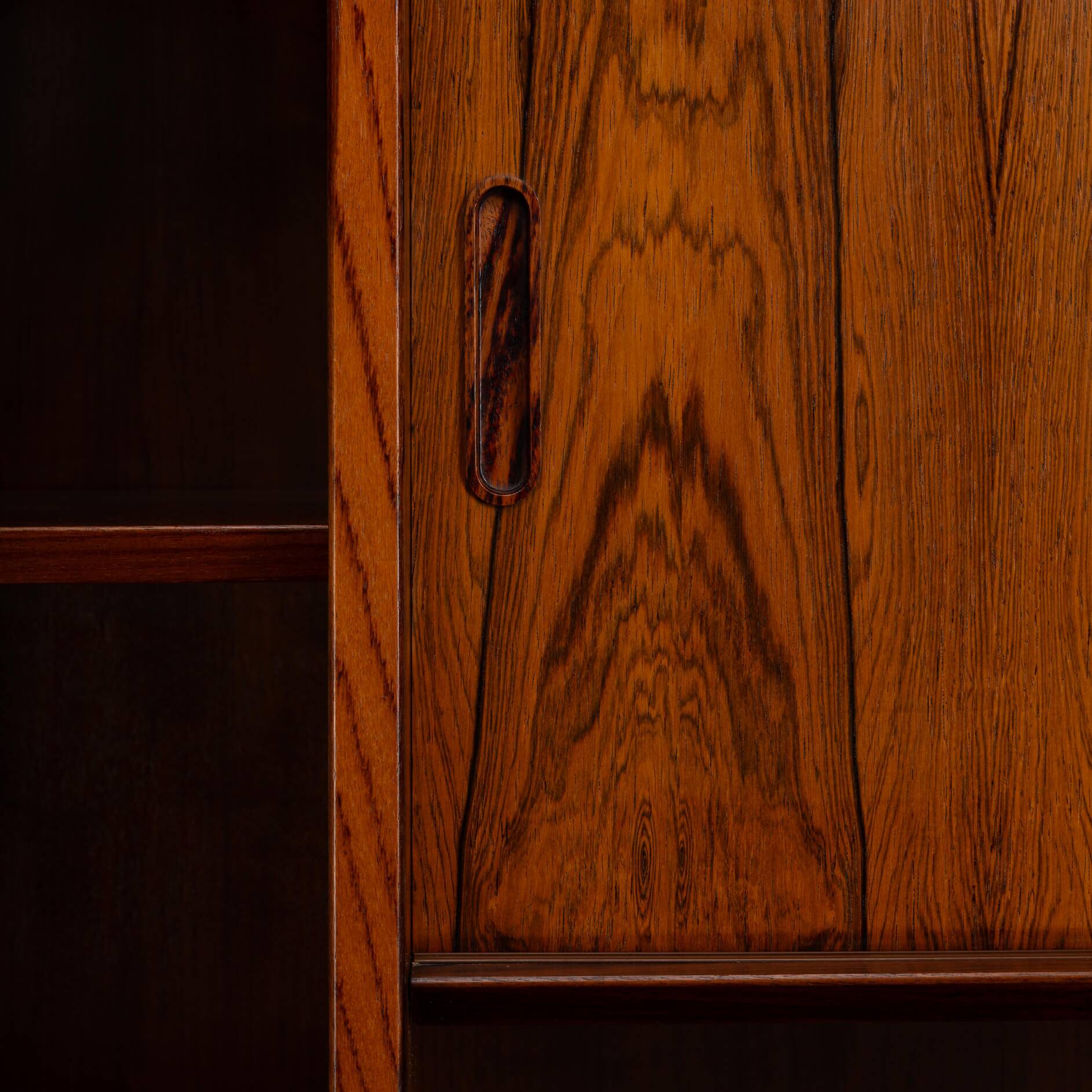 Rosewood library designed by Danish designers with doors by Hundevad & Co, 1960s.