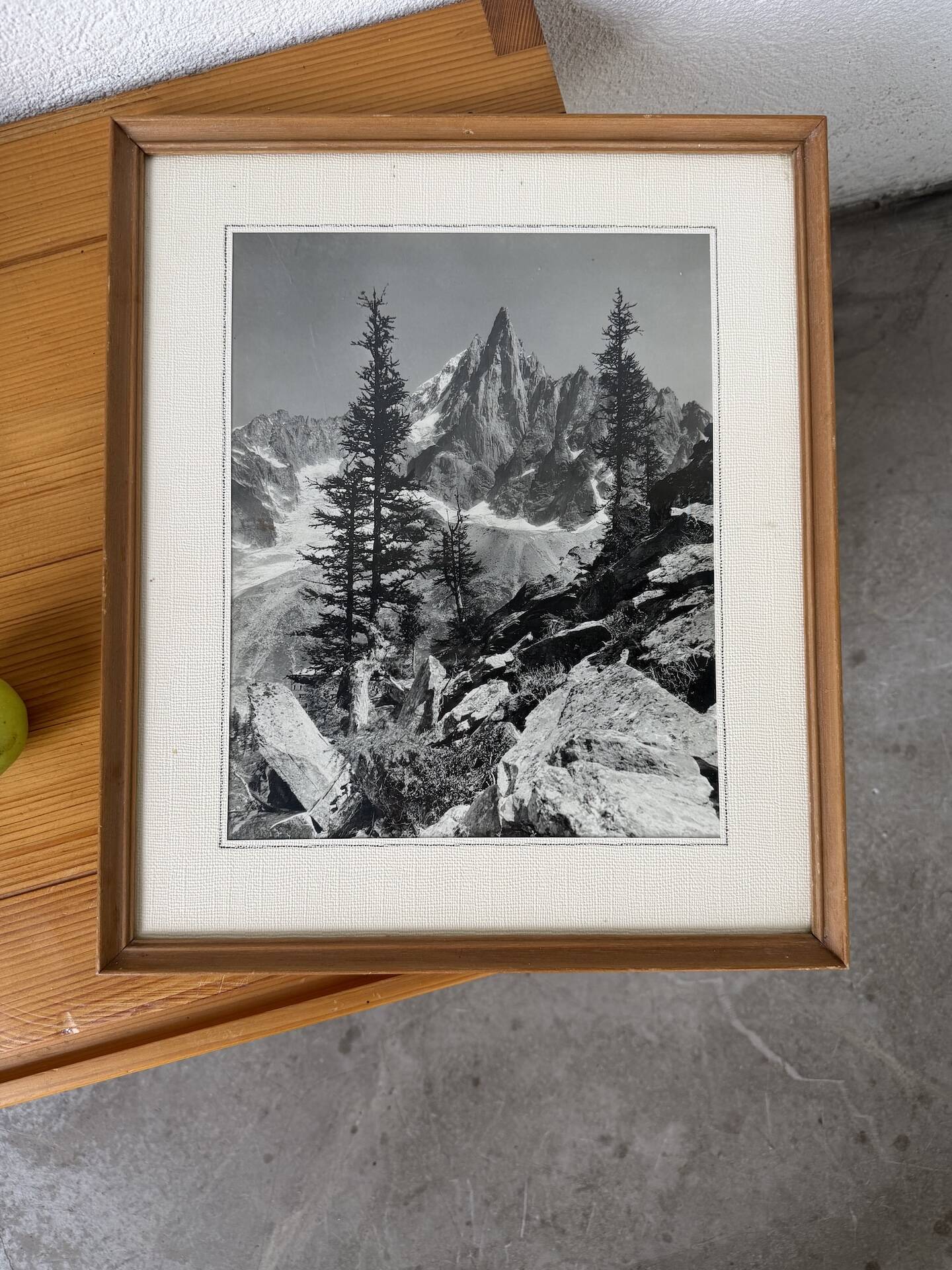 Framed old photo of a mountain landscape.