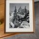 Framed old photo of a mountain landscape.