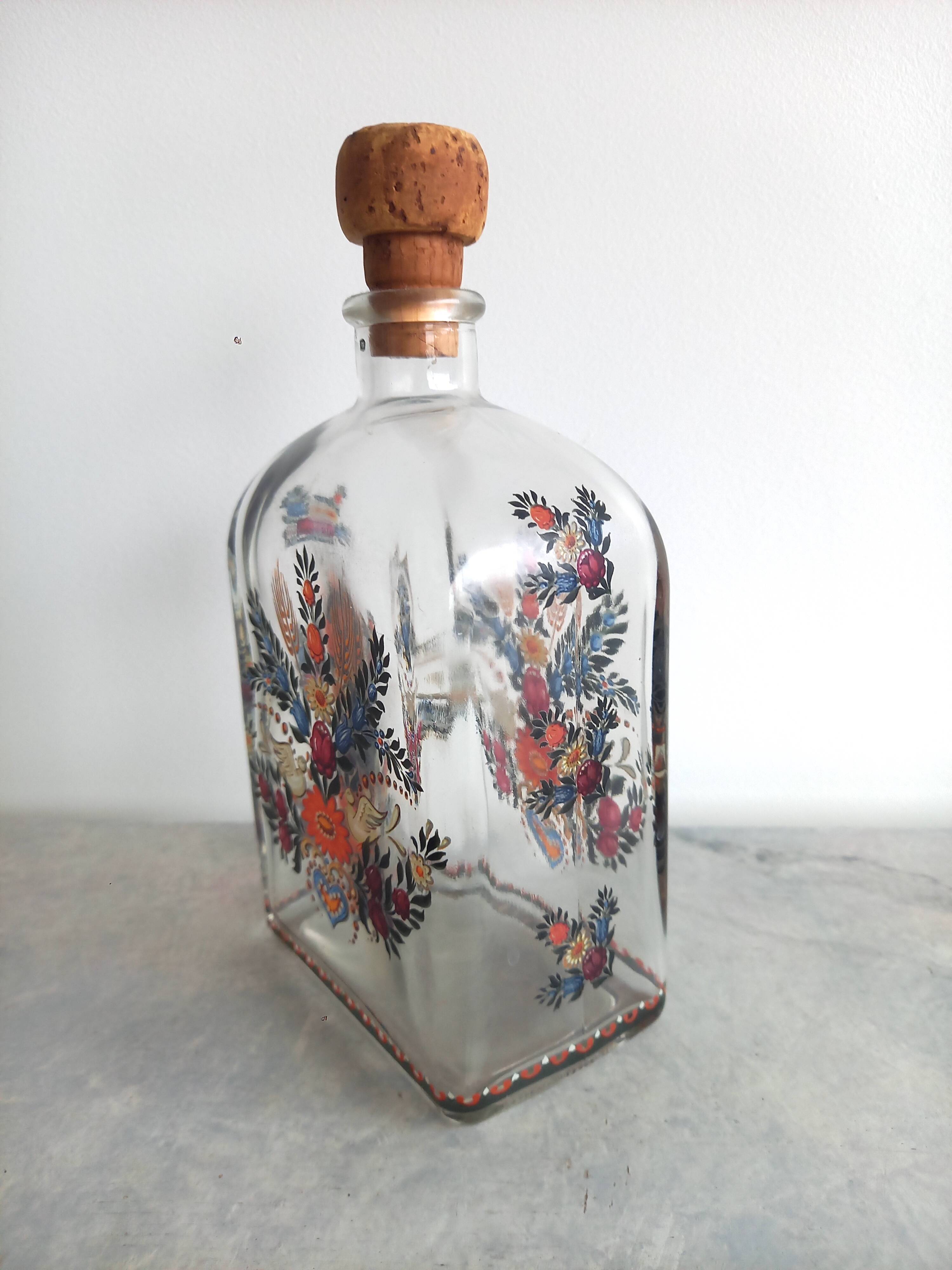 Bottle with folkloric decoration of flowers and birds inspired by Eastern countries
