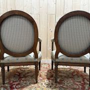 Pair of cabriole armchairs with medallion backs from the Louis XVI period, stamped OT.
