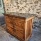 French antique walnut commode with a dark grey marble top, circa 1830–1860.