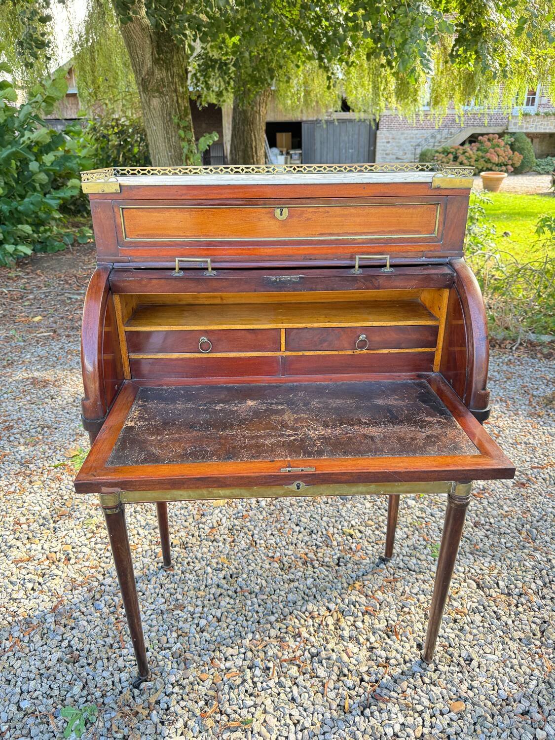 Elegant and rare Louis XVI period mahogany cylinder desk