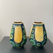 A pair of green and yellow vases