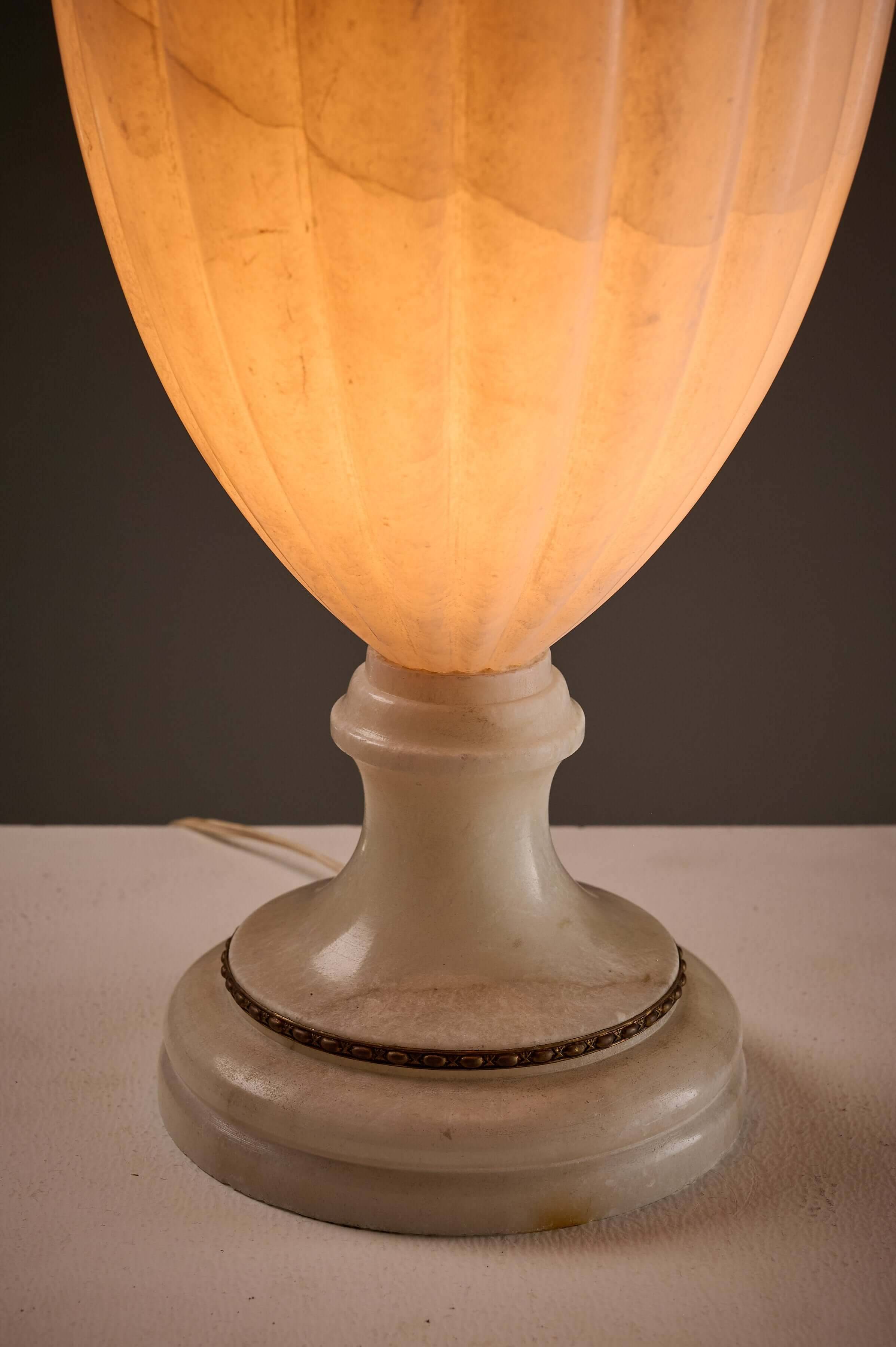 Carved alabaster urn lamp with stylized fish handle