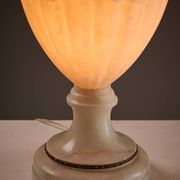 Carved alabaster urn lamp with stylized fish handle