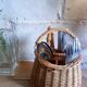 Covered rattan basket for lunch on 50s grass