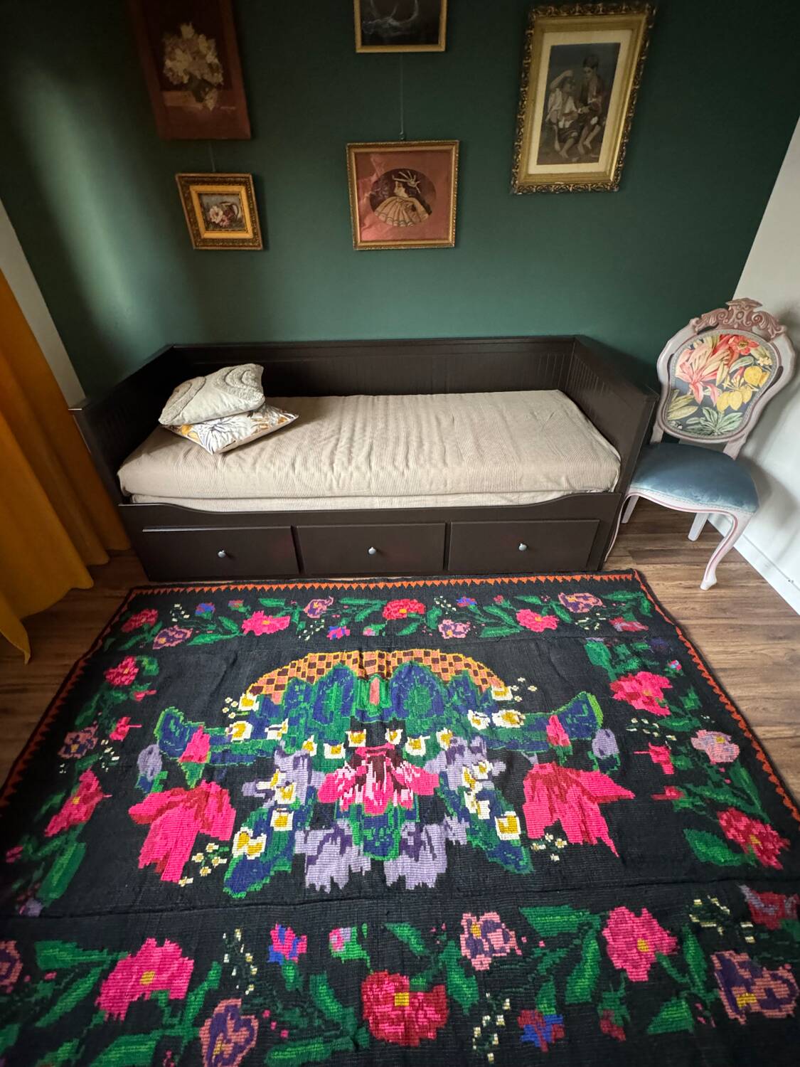 Romanian black wool carpet with a basket of colorful flowers