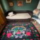 Romanian black wool carpet with a basket of colorful flowers