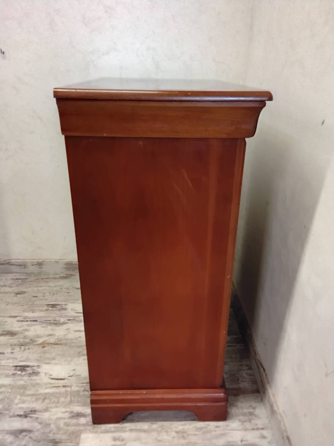 Wooden chest of drawers with a secret drawer