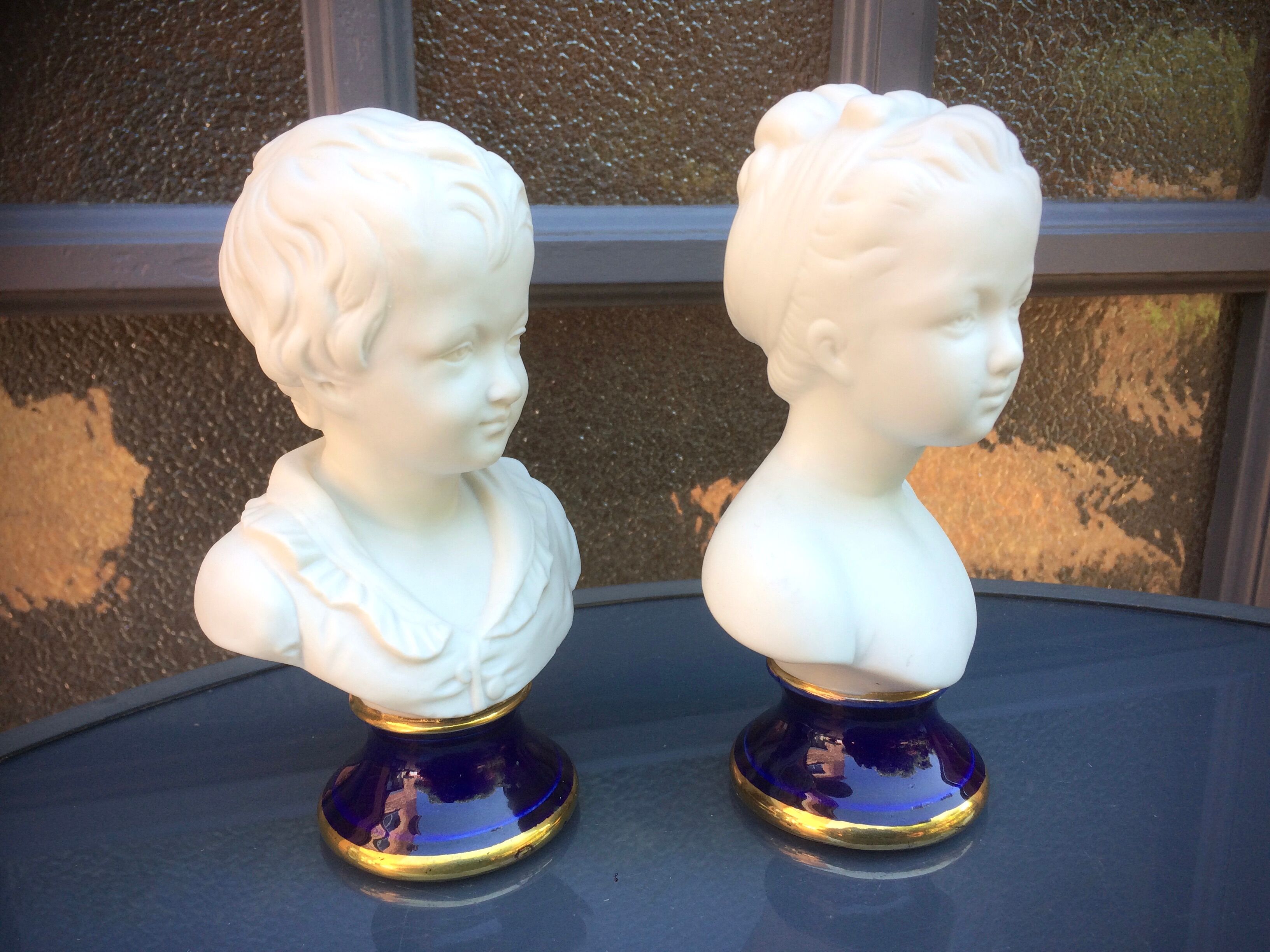 Children's busts in biscuit