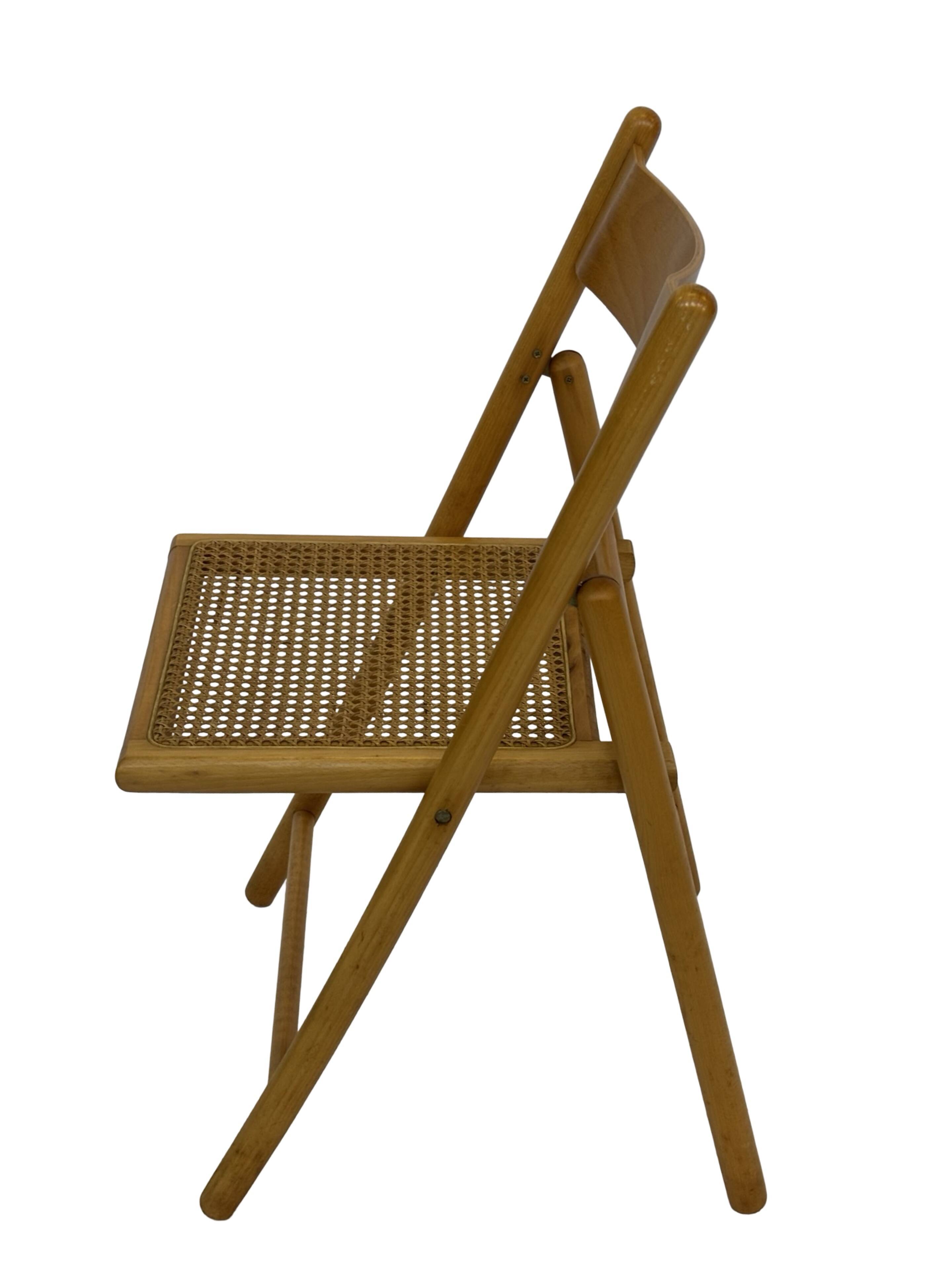 Vintage wooden folding chair with rattan seat 80s minimalist design