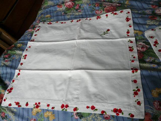 pair of monogrammed RB embroidered pillowcases in pink and red