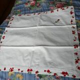 pair of monogrammed RB embroidered pillowcases in pink and red