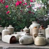 Old vinaigrier in sandstone vintage pot