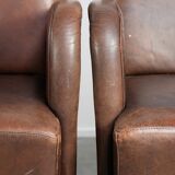 Set of 4 nicely finished dining chairs/side chairs with armrests made of cowhide leather
