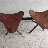 Pair of folding leather tripod stools from the 1950s