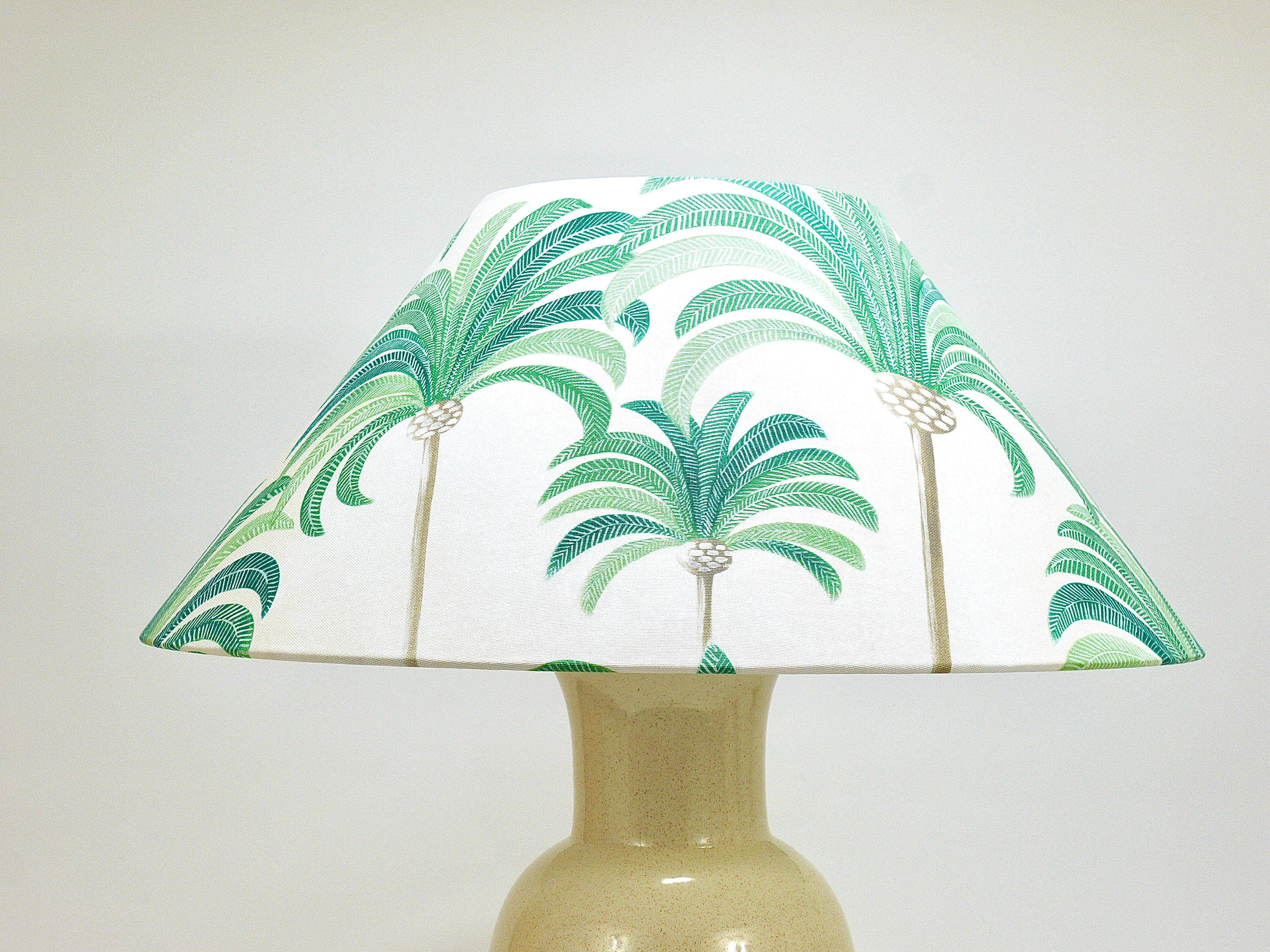 Pair of Tommaso Barbi Riviera palm tree table lamps from the 1970s with matching cushions.