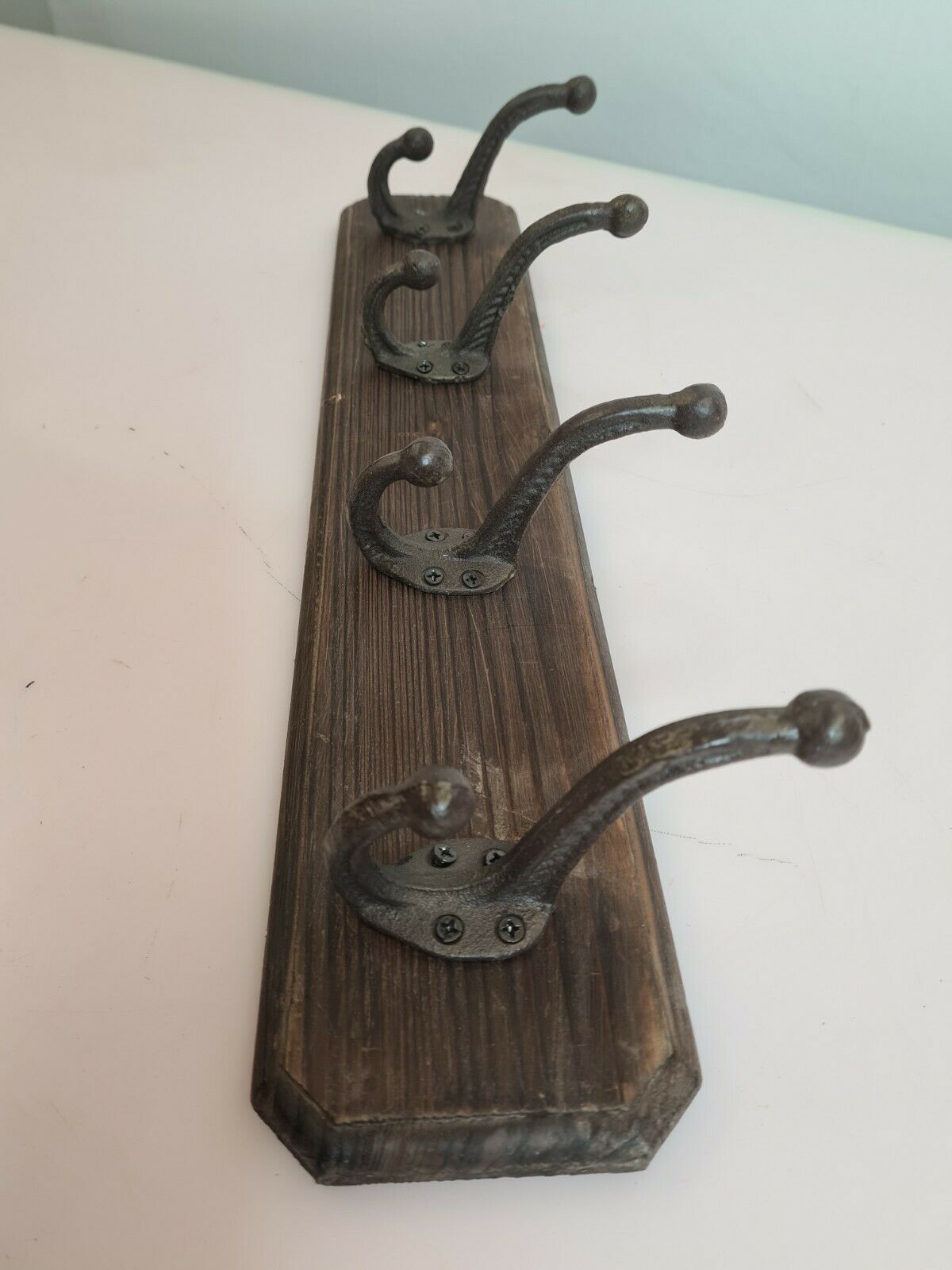 Wooden coat rack and cast iron hooks