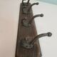 Wooden coat rack and cast iron hooks