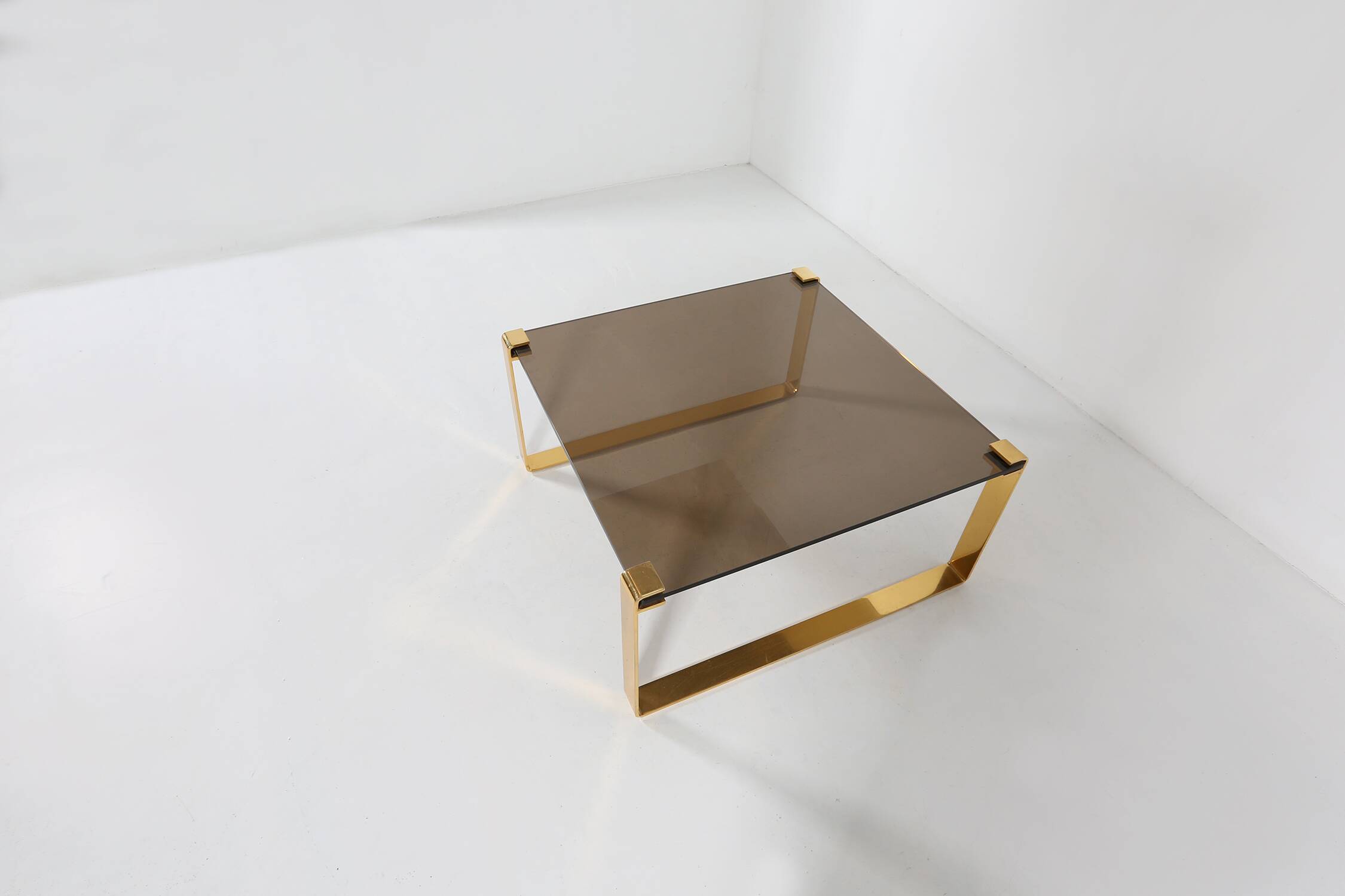 Mid-century coffee table with gold plated base and glass top, 1970s