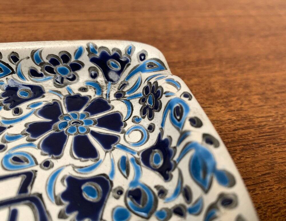 Vintage handmade blue ceramic ashtray with deer and flower ornament from Rodos Ceramics.