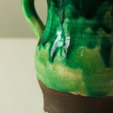 Glazed ceramic pitcher in green and brown by the potter Pierre Roulot.