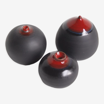 Trio of black and red ceramics by Antonio Lampecco