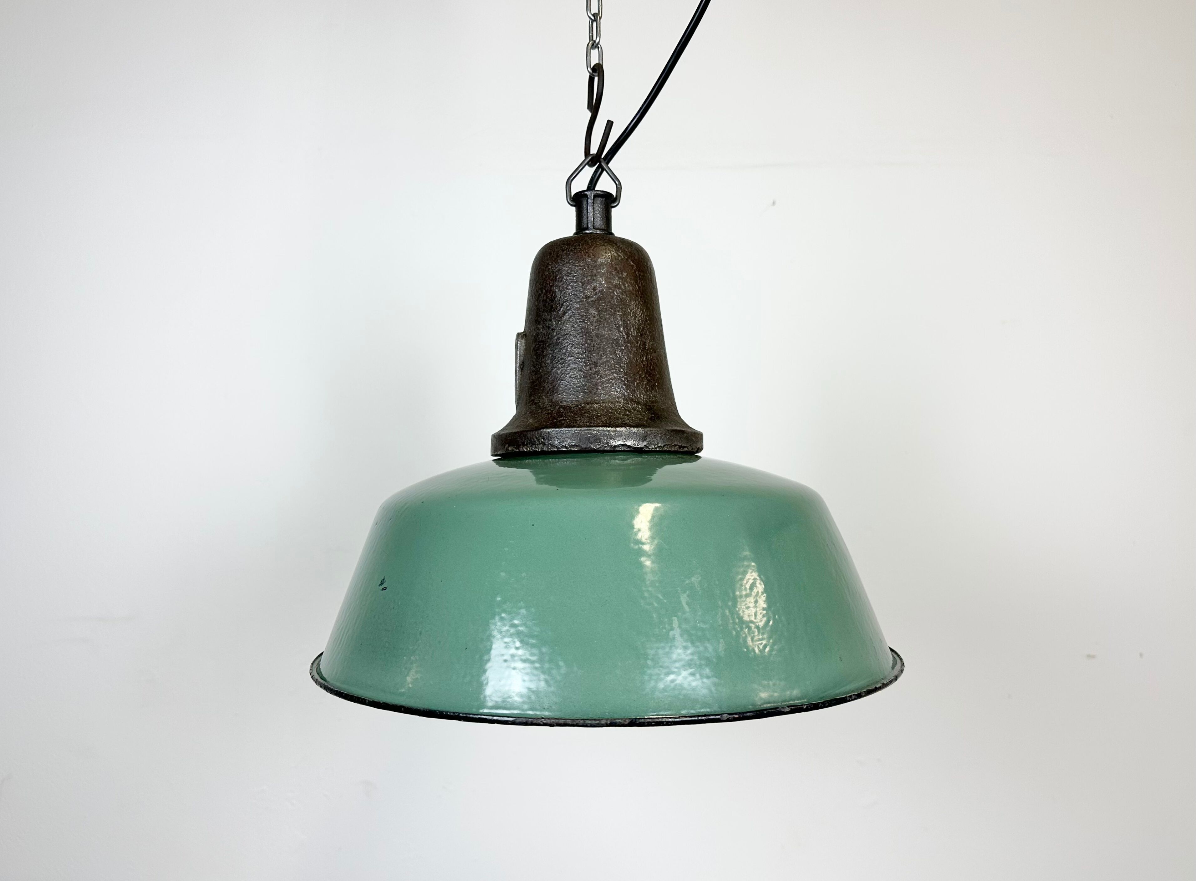 Industrial green enamel factory lamp with cast iron top, 1960s