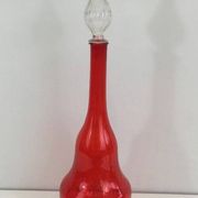 Large designer bottle in red glass