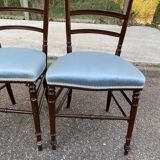 2 Napoleon III chairs in solid wood and blue satin fabric.