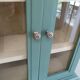 Green and beige 2-door wall display case