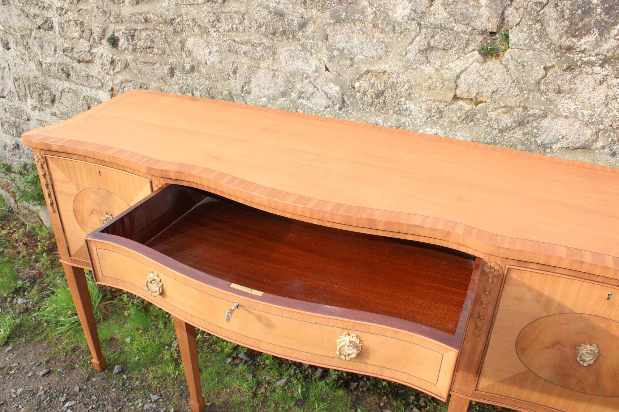 English-made enfilade in Louis XVI style with light wood veneers.